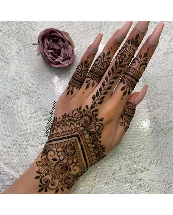 Artistic Contrast With Diamond Covering Back Hand Mehndi Design